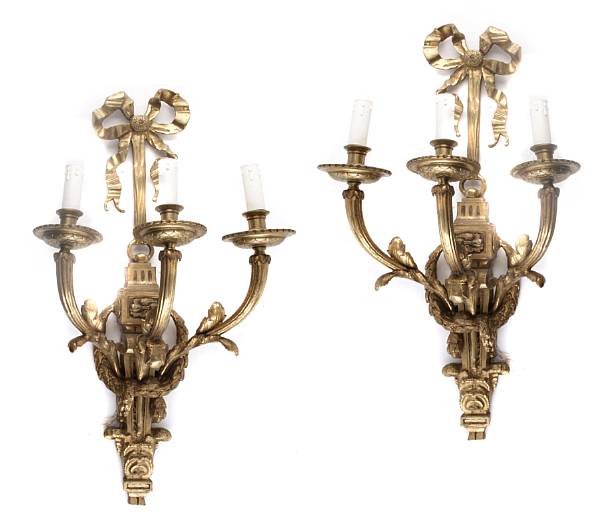 Appraisal: A pair of Louis XVI style gilt bronze three light