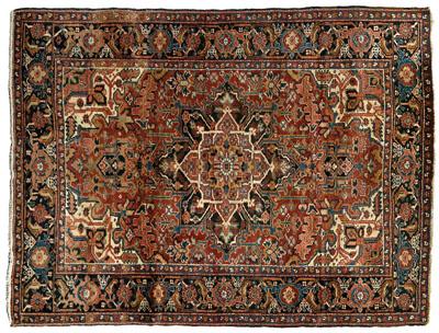 Appraisal: Heriz rug typical designs on a brick red field ivory