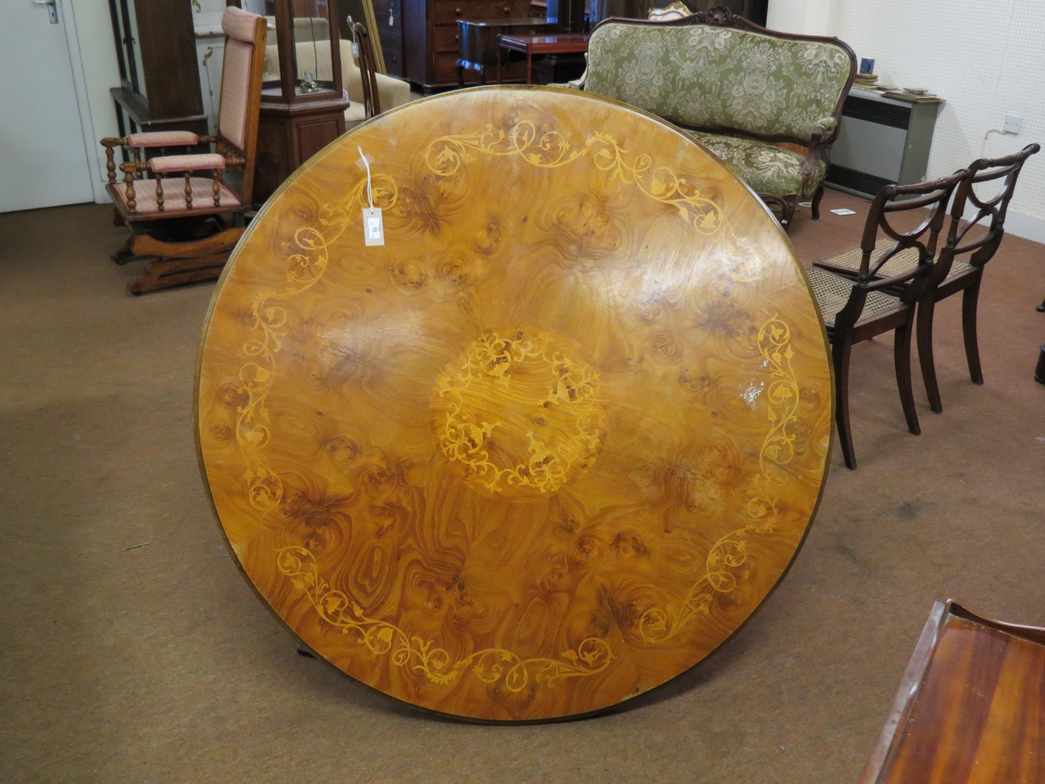 Appraisal: A Victorian elm and marquetry breakfast table circular top veneered