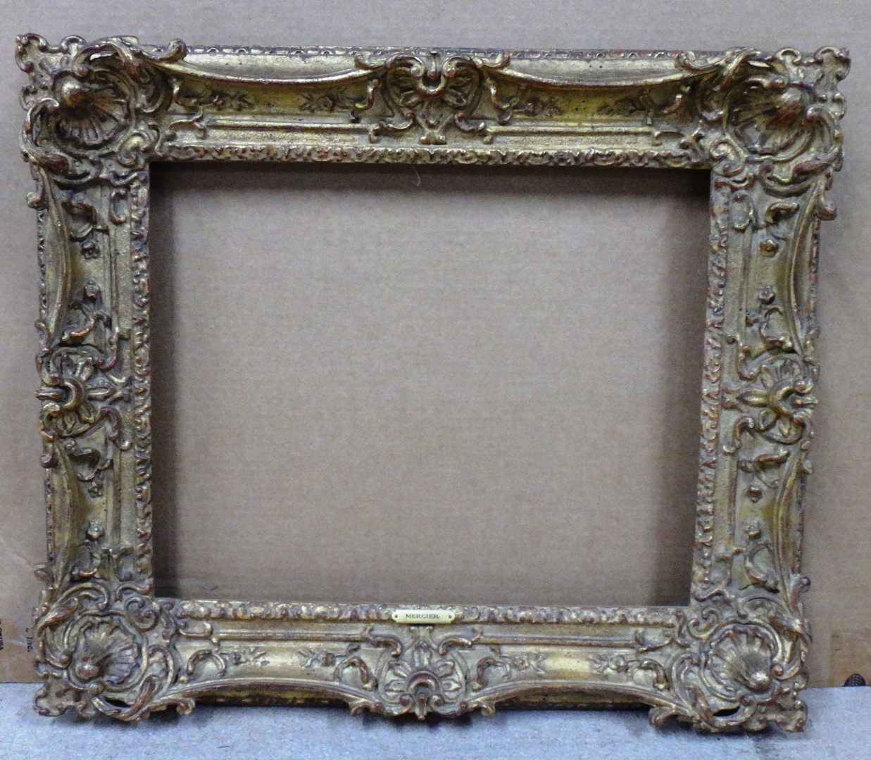 Appraisal: A th century Continental gilt plaster swept frame the aperture