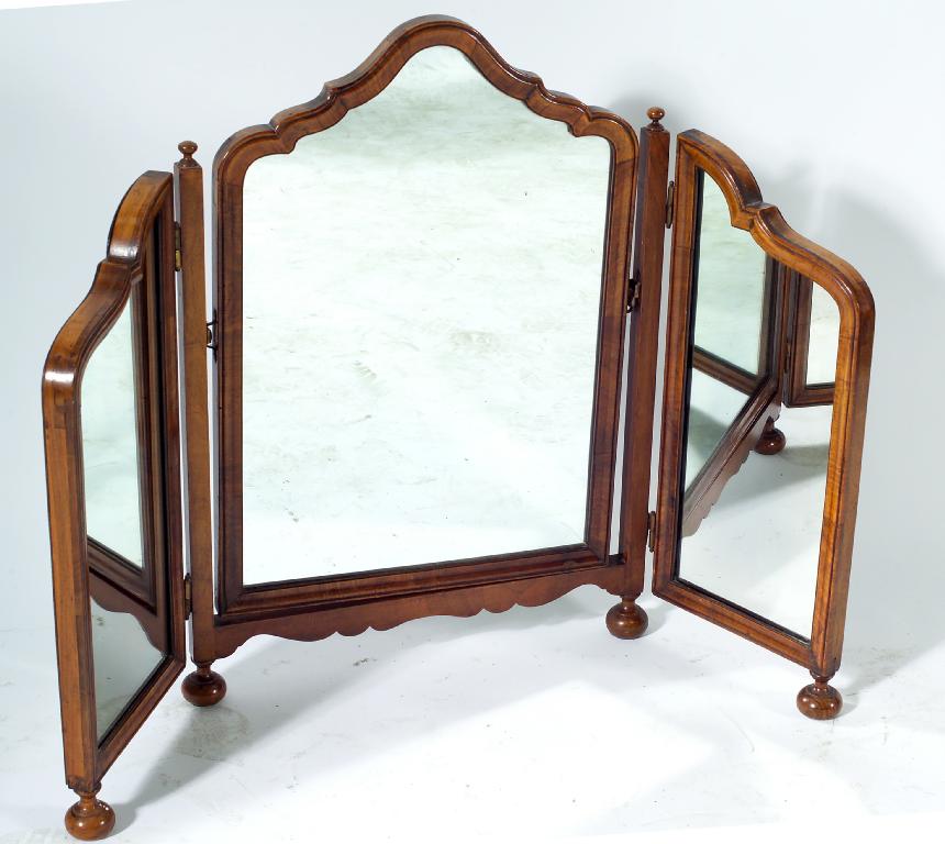 Appraisal: WALNUT TRYPTYCH DRESSING TABLE MIRROR IN WILLIAM MARY STYLE the