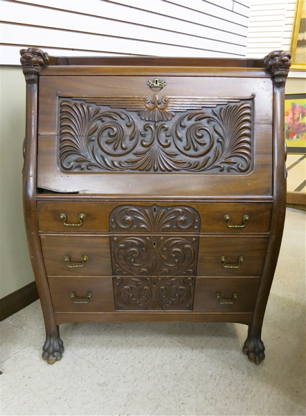 Appraisal: LATE VICTORIAN CARVED MAHOGANY SLANT-FRONT SECRETARY American c the slant