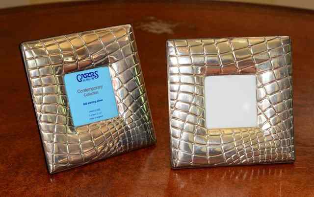 Appraisal: A PAIR OF SILVER PHOTO FRAMES square