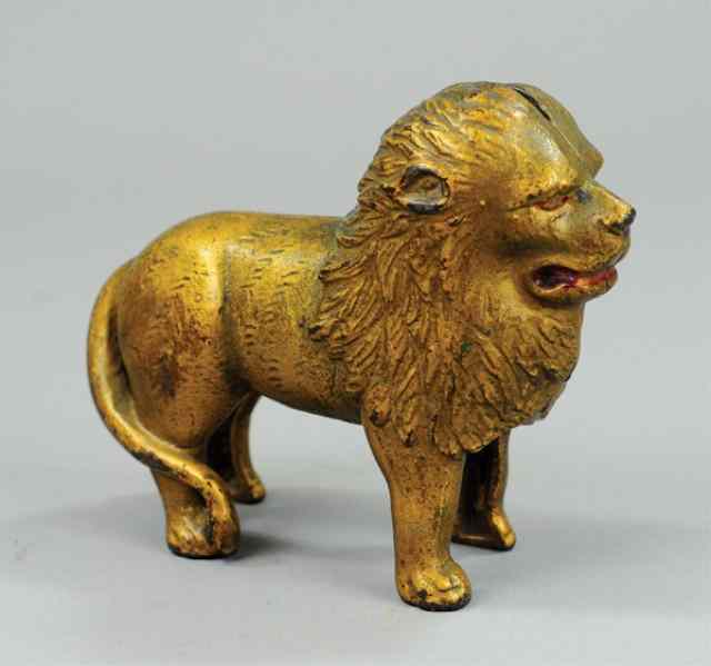 Appraisal: STANDING LION STILL BANK Cast iron includes large lion tail