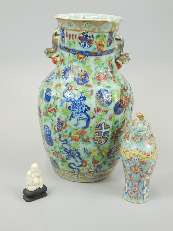 Appraisal: A Chinese canton style decorated vase with a petalated top