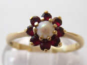 Appraisal: A carat gold garnet and cultured pearl ring size P