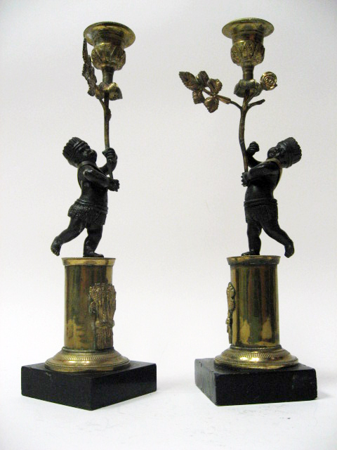 Appraisal: A Pair of French Empire Figural Candlesticks bronze and gilt