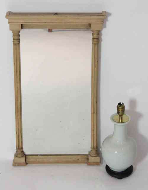 Appraisal: A Victorian pine mirror with fluted column sides cm high