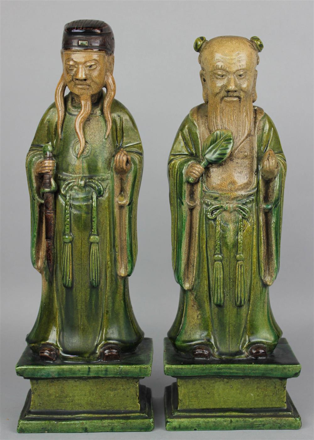 Appraisal: TWO CHINESE GLAZED POTTERY FIGURES OF IMMORTALS QING DYNASTY the