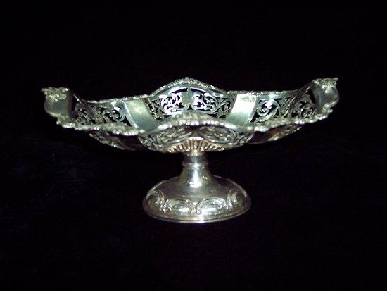 Appraisal: An oval shaped basket with foliate and C scroll border