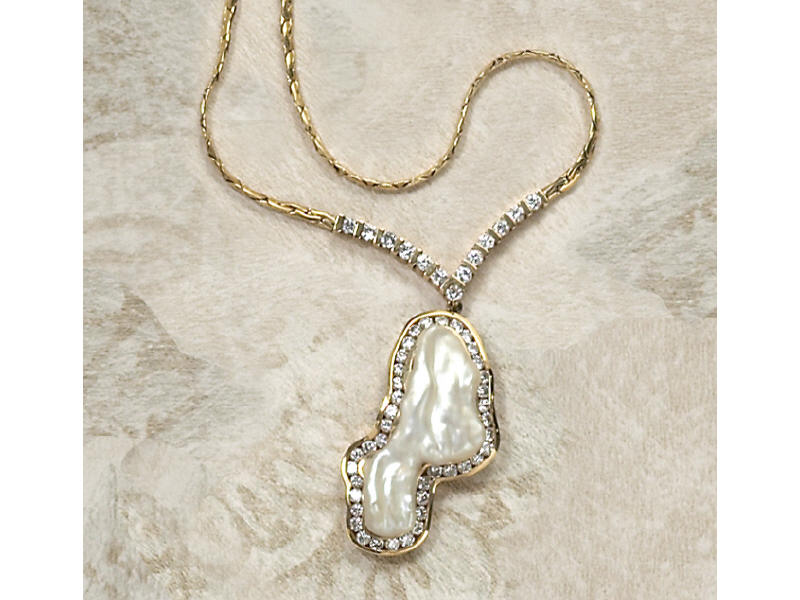 Appraisal: PEARL AND DIAMOND PENDANT Baroque mabe pearl measuring inch x