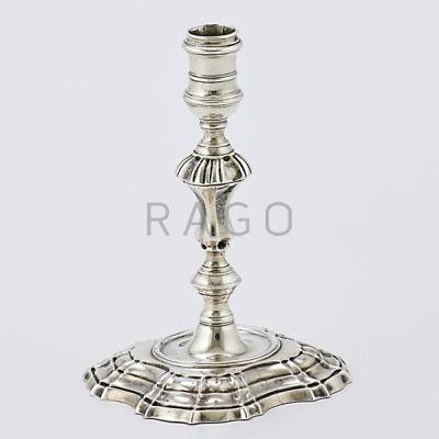 Appraisal: GEORGE II MINIATURE STERLING CANDLESTICK Cast with knopped column and