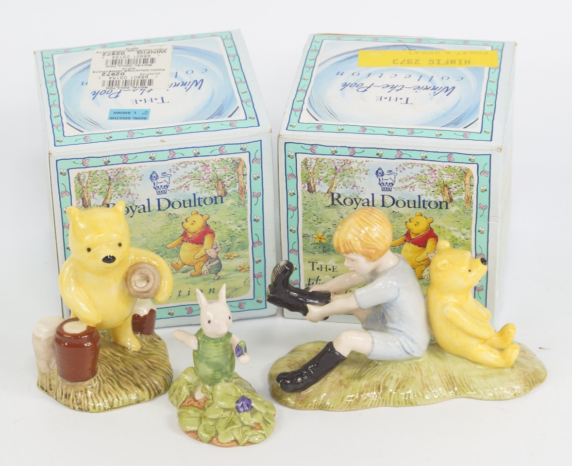 Appraisal: Three Royal Doulton Winnie the Pooh figures modelled as Christopher