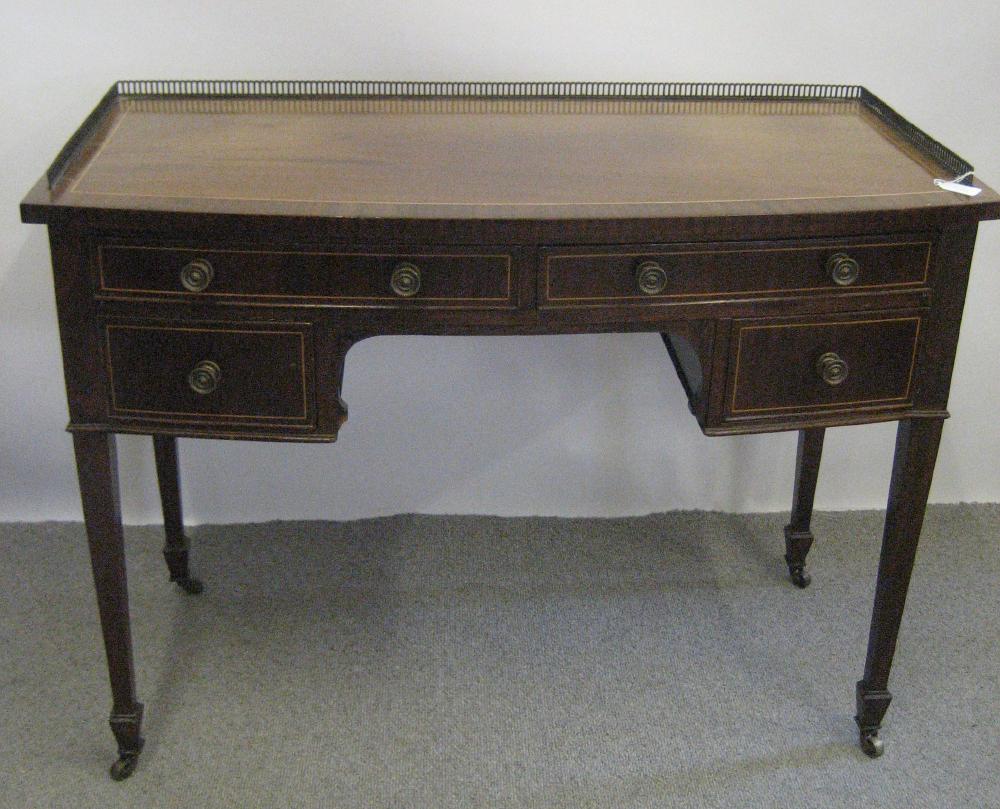 Appraisal: A MAHOGANY DRESSING TABLE late th century of bowed form