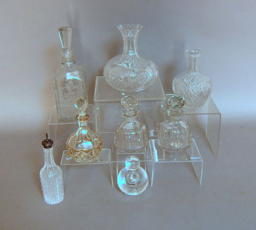 Appraisal: Eight colorless glass decanters and bottles