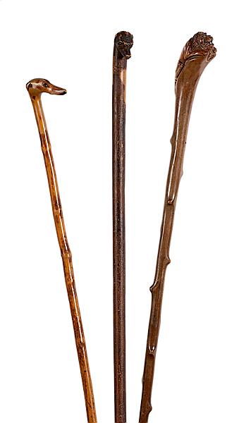 Appraisal: FIGURAL FOLK ART CANES Continental late th century Lot of