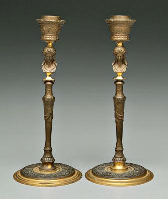 Appraisal: Pair Empire style brass candlesticks shafts with classical heads above