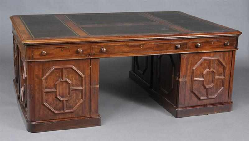 Appraisal: VICTORIAN MAHOGANY FOUR-PEDESTAL PARTNER'S DESK The three-paneled gilt-tooled leather top