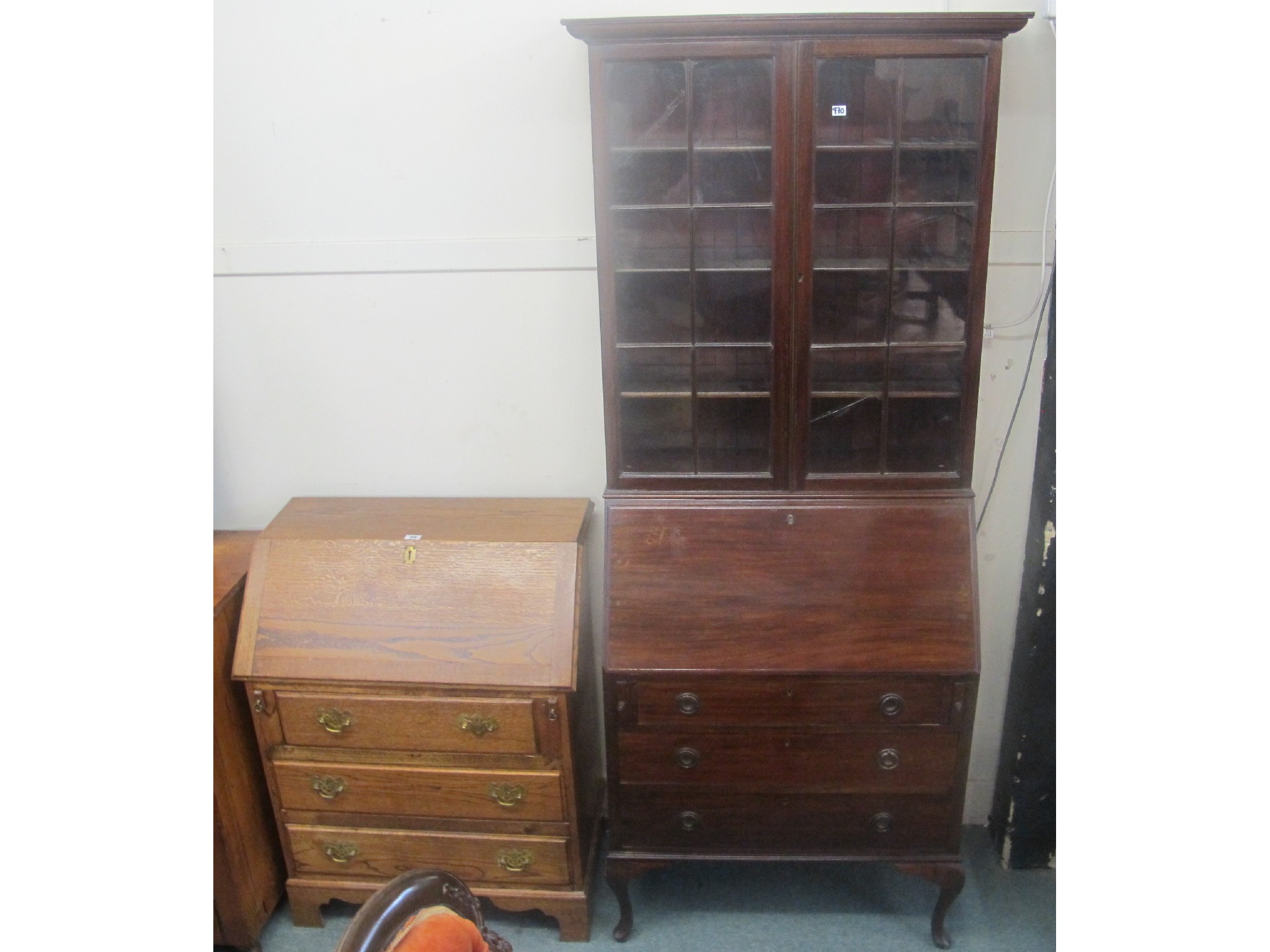 Appraisal: An oak bureau and a mahogany bureau bookcase