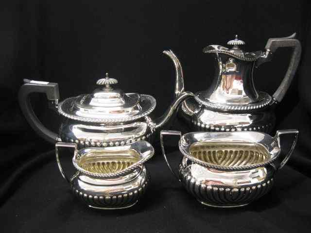 Appraisal: English Silverplate Tea Coffee Service ribbed design gadroon trim ebony