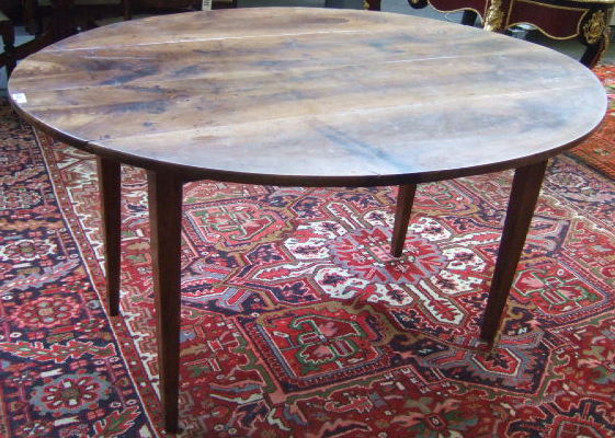 Appraisal: An early th century French walnut table the four plank