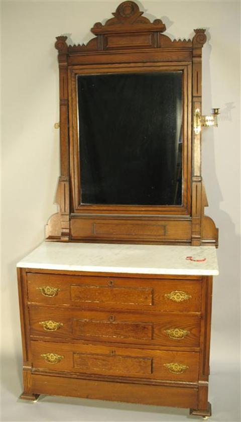 Appraisal: VICTORIAN EASTLAKE STYLE MARBLE DRESSER The carved and molded crest