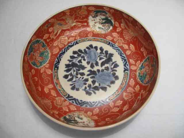 Appraisal: Japanese Imari bowl with iron red ground cobalt floral center