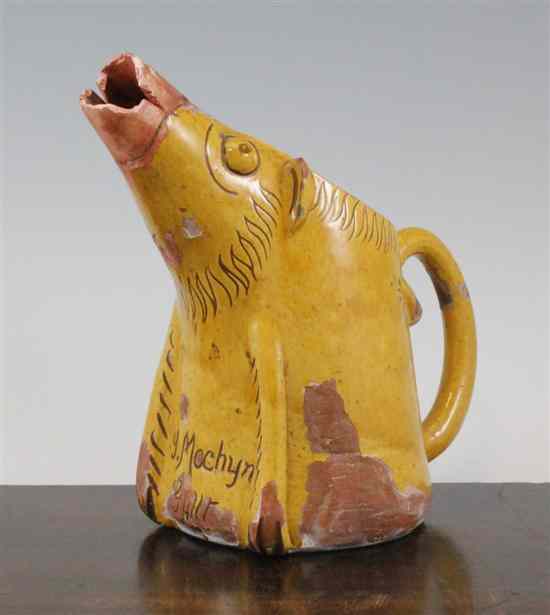 Appraisal: A Elvenny yellow glazed slipware jug early th century in