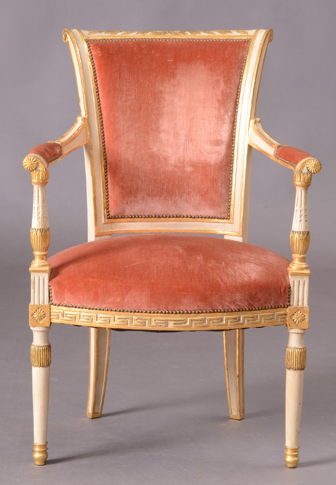 Appraisal: DIRECTOIRE CREAM-PAINTED AND PARCEL-GILT FAUTEUIL EN CABRIOLET With an outscrolled