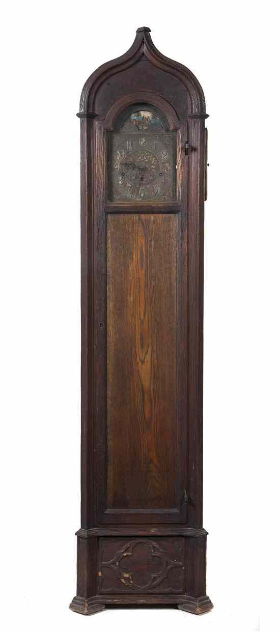 Appraisal: A Gothic Revival Tall Case Clock having a peaked crest