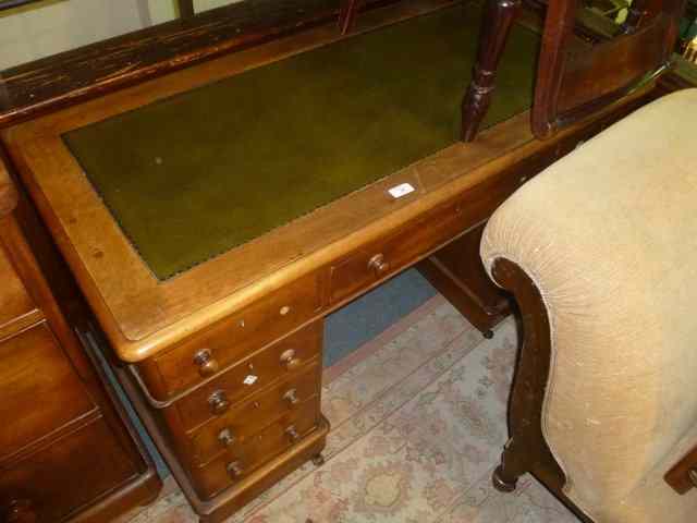 Appraisal: A VICTORIAN MAHOGANY PEDESTAL DESK of nine drawers with inset