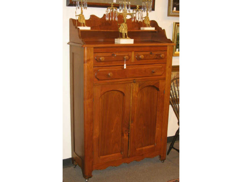 Appraisal: AMERICAN TH CENTURY WALNUT CUPBOARD Molded top with shaped gallery