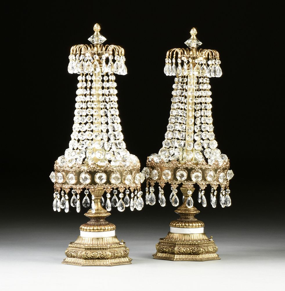 Appraisal: A PAIR OF HOLLYWOOD REGENCY STYLE SIX LIGHT CUT CRYSTAL