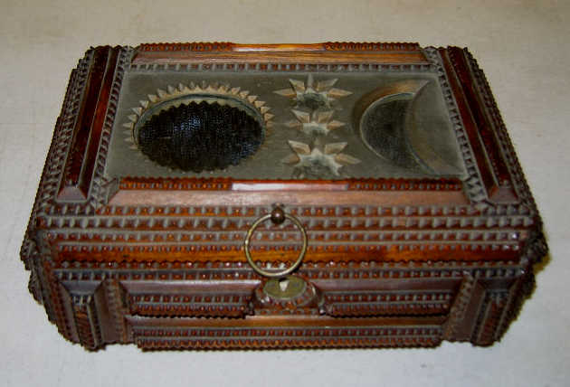 Appraisal: AMERICAN TRAMP ART LIDDED BOX The rectangular box having elaborate