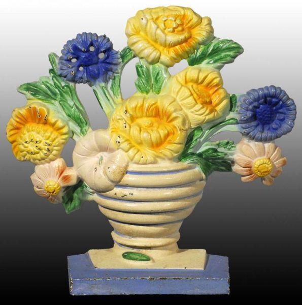 Appraisal: Cast Iron Marigolds Flower Doorstop Description Made by Hubley Marked