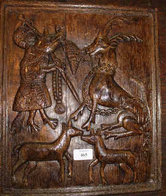 Appraisal: AN ANTIQUE CARVED OAK PANEL with stag and stylised figure