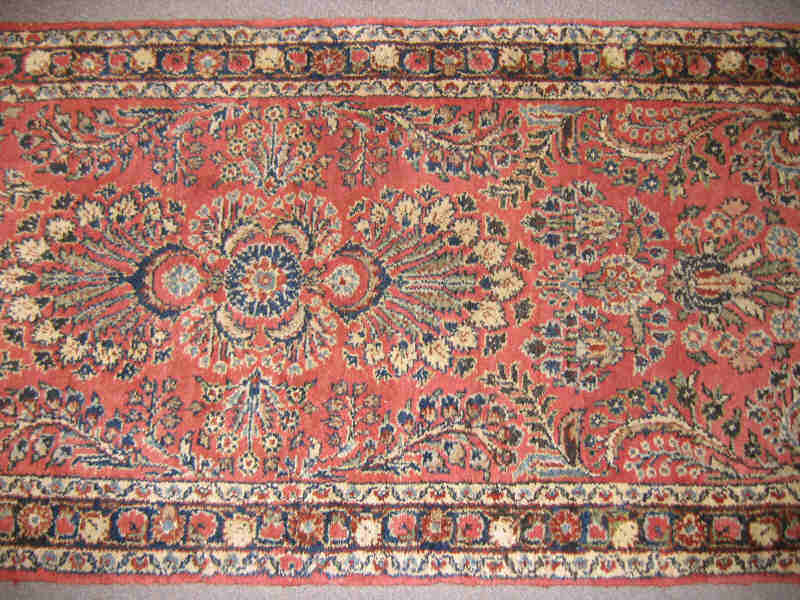 Appraisal: HAMADAN RUNNER The red field with allover pattern of curvilinear