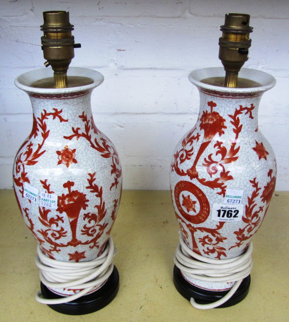 Appraisal: A pair of modern porcelain table lamp vases decorated with