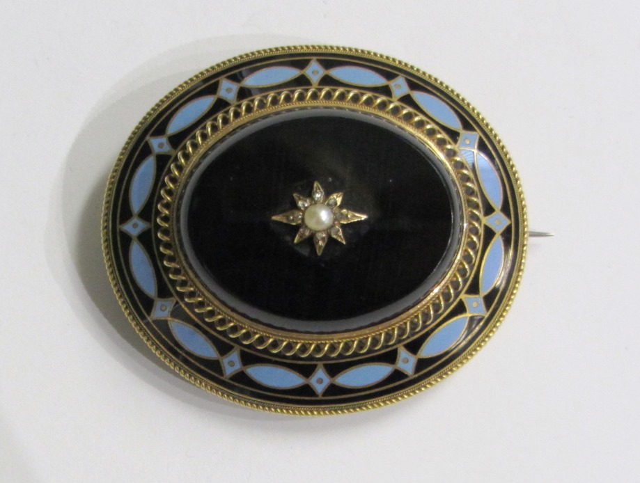 Appraisal: A Victorian gold mounted enamelled and gem set oval mourning