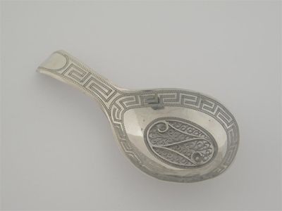 Appraisal: A George III caddy spoon with an inset filigree panel