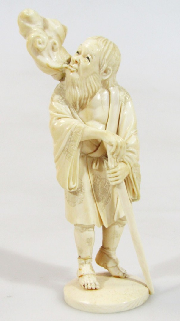 Appraisal: A Japanese Meiji period ivory figure of a gentleman in