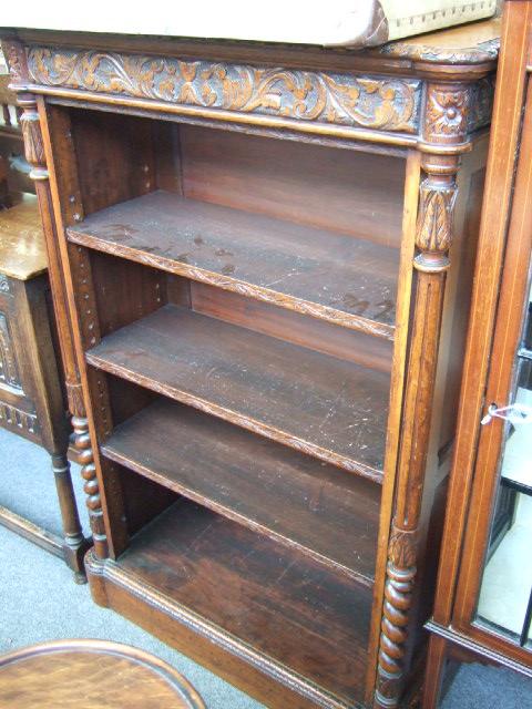 Appraisal: An oak floor standing open bookcase enclosing three adjustable shelves