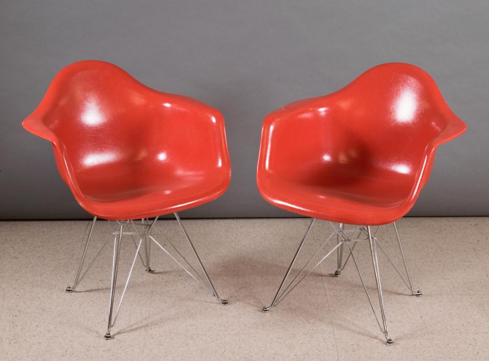 Appraisal: A PAIR OF EAMES RED FIBERGLASS SHELL ARMCHAIRS Case Study