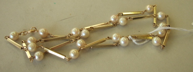 Appraisal: A gold and cultured pearl necklace designed as a row