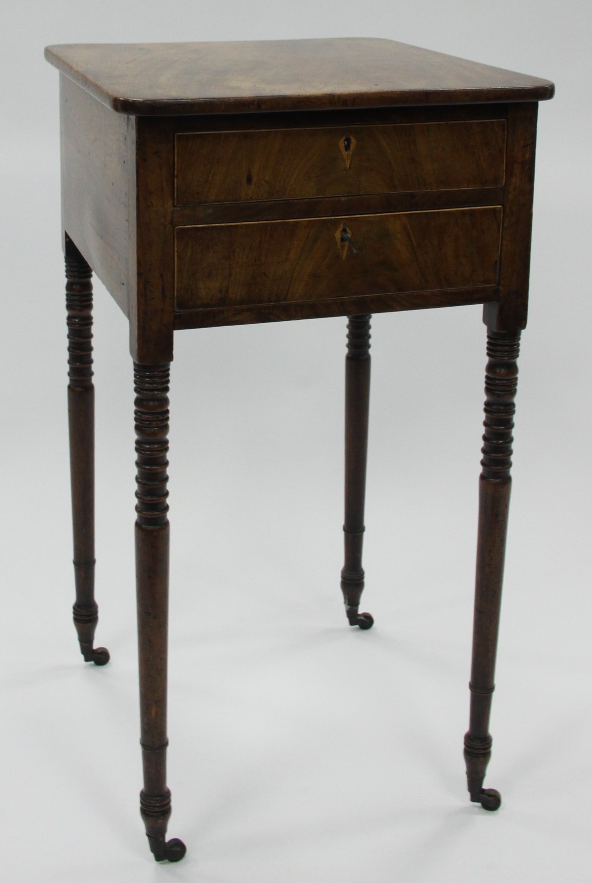 Appraisal: An early th Century mahogany bedside table fitted two drawers