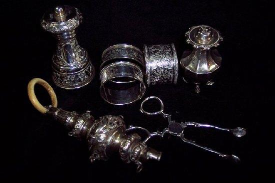 Appraisal: A silver pepper mill embossed floral decoration J P and