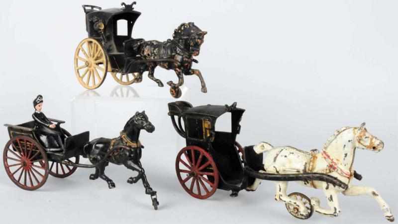 Appraisal: Lot of Cast Iron Horse-Drawn Carriage Toys American Includes two