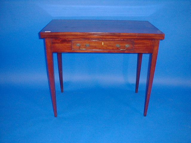 Appraisal: An early th century mahogany tea table with rectangular folding