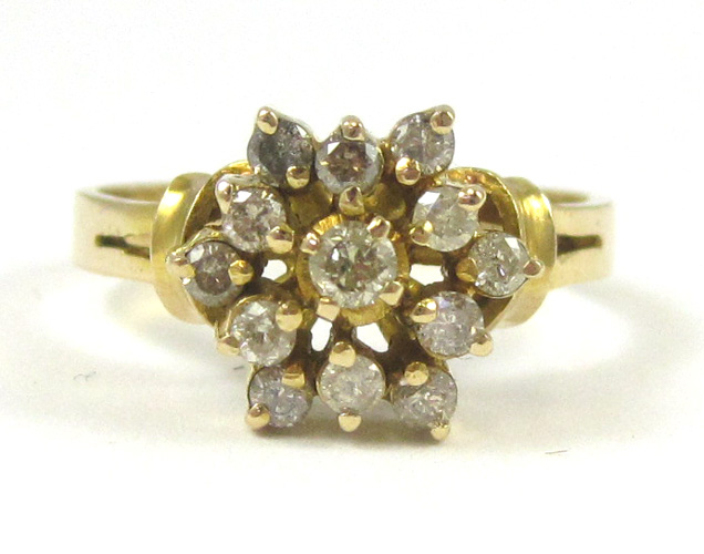 Appraisal: DIAMOND AND FOURTEEN KARAT GOLD RING set with round-cut diamonds