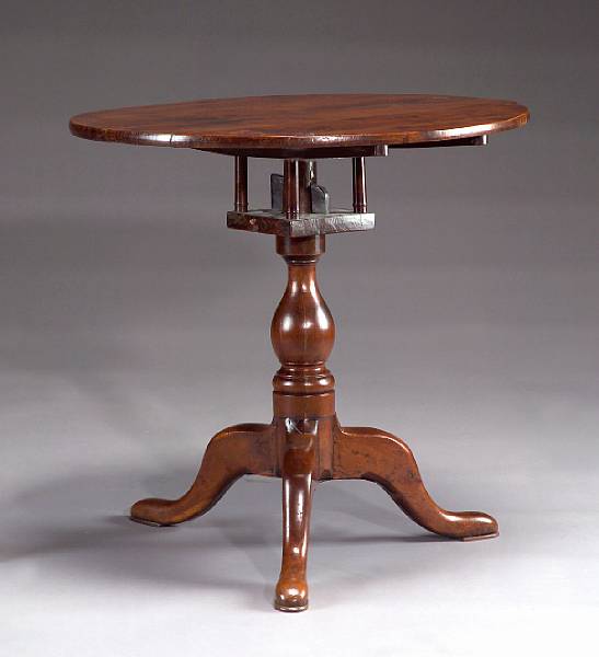 Appraisal: A George III yew wood revolving tea table late th